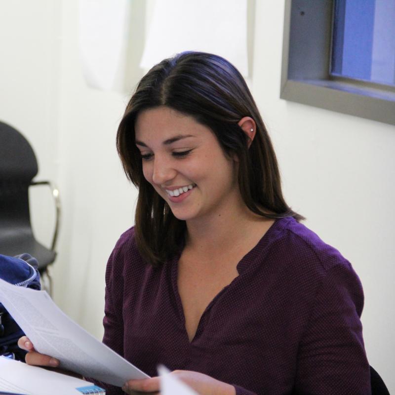 Graduate Studies student smiling in classroom Graduate Studies student smiling in classroom