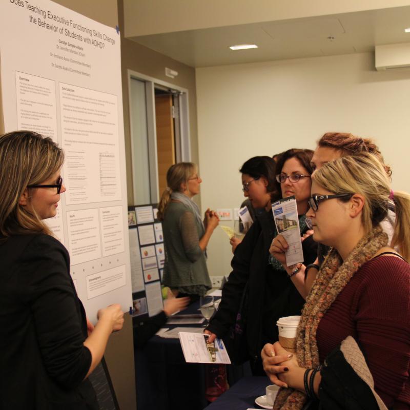 Group of students with a one student presenting